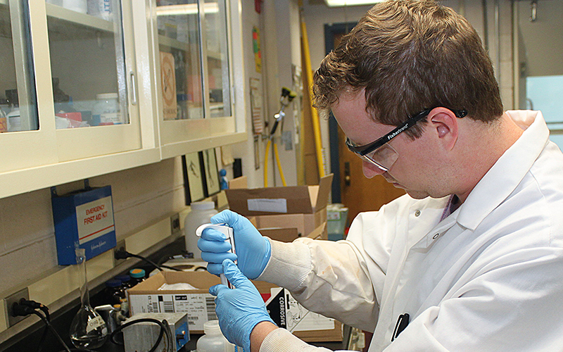 Student testing water samples