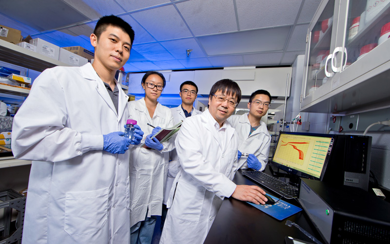 ChBE grad students with a salt water battery