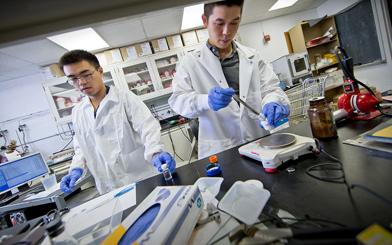 Students working on saltwater battery in the lab