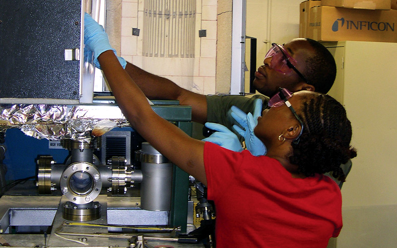 Two ChBE students at work on a science project